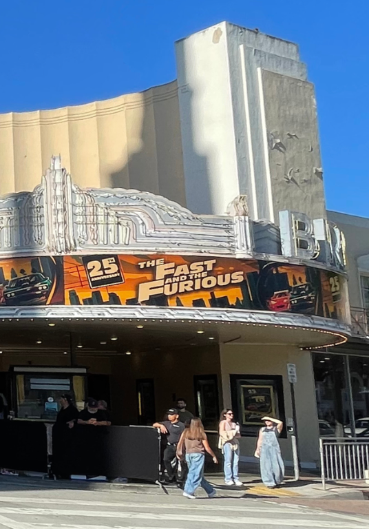 Exterior shot of the Bruin Theatre in Westwood Village with patrons walking inside
